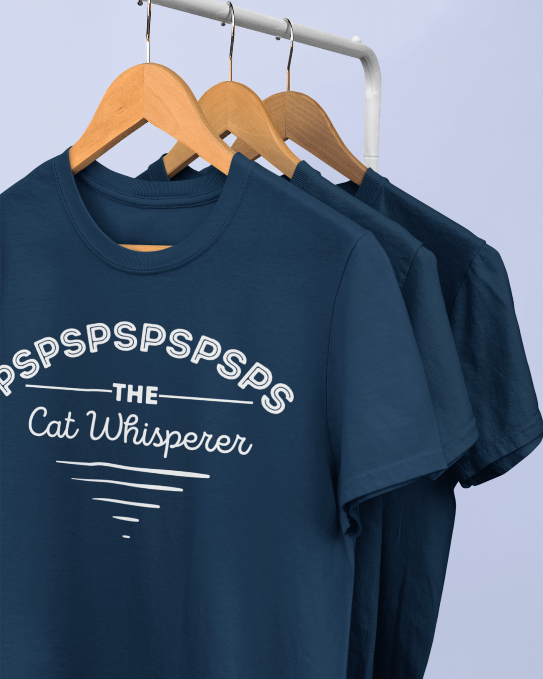 funny t-shirt on a hanger which read "the cat whisperer"